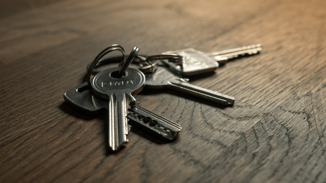 a close-up of a set of keys on a wooden surface